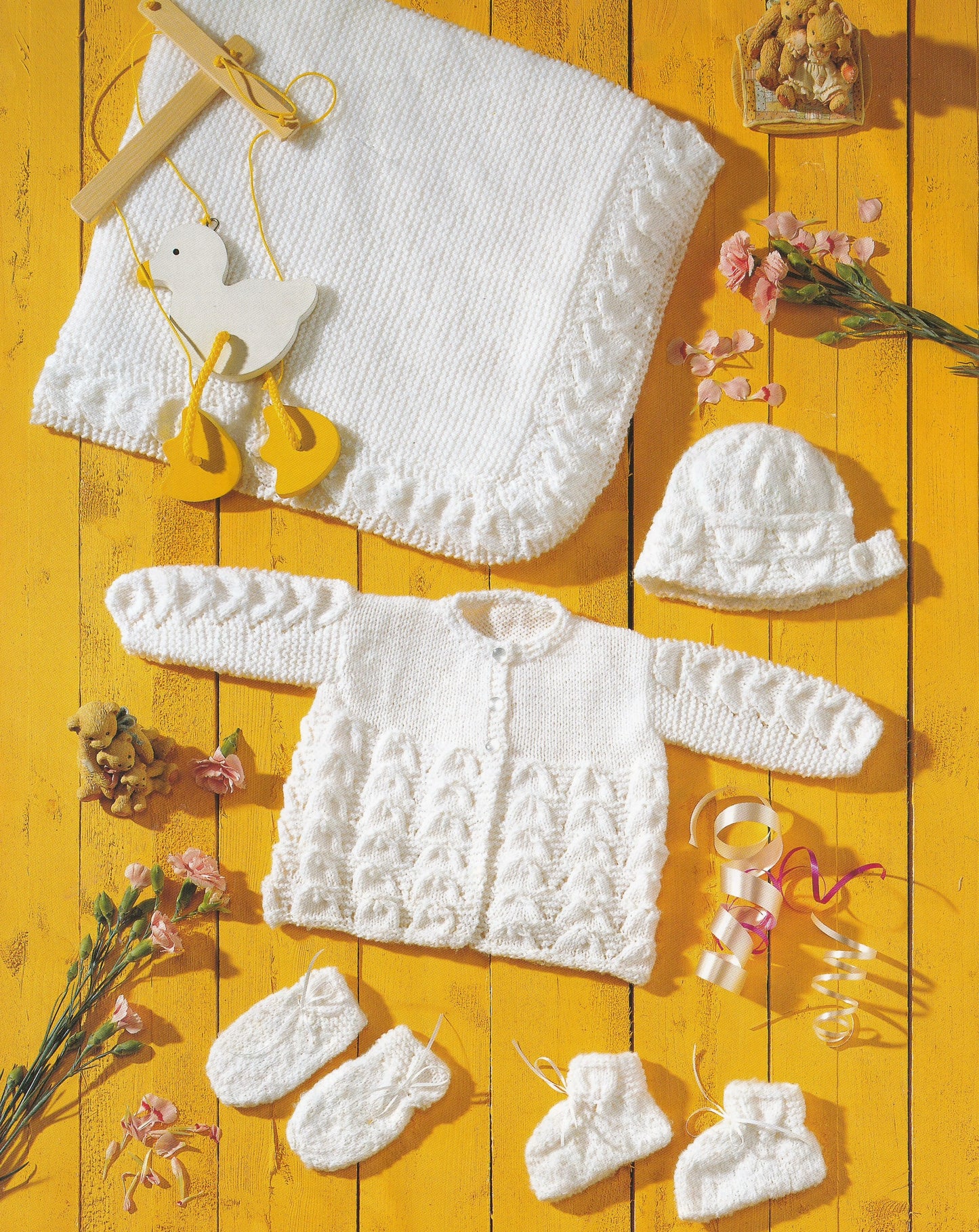 Baby layette set with blanket, matinee cardigan, bonnet, mittens and booties